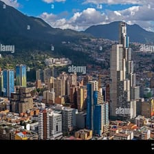 A view of Bogotá, Colombia, with the city skyline and surrounding mountains.