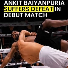 An athlete winning a competition against an opponent.