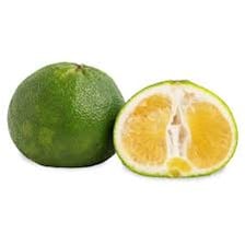 A wrinkled greenish-yellow Ugli citrus fruit cut open