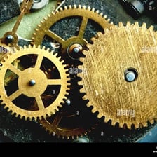 Close-up of interlocking gears inside a clock