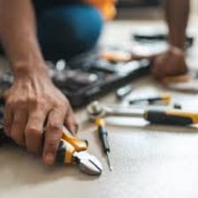 A person working with a hand tool