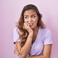 A person fidgeting nervously.
