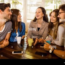 People engaged in a casual conversation at a cafe
