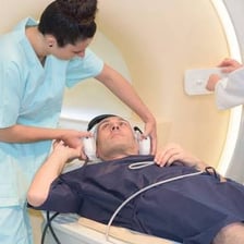 A patient being examined inside an MRI scanner.