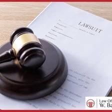 Legal papers and a gavel representing a court action