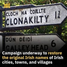 A road sign displaying Irish Gaelic text.