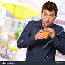 A person drinking a beverage through a straw