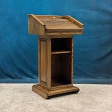 A lectern positioned on a raised platform.