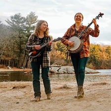 Bluegrass musicians performing with banjos.