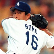 Hideo Nomo delivering a pitch on a baseball field