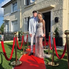 A very important person posing at a red carpet event