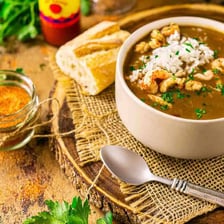Bowls of gumbo and creamy bisque displayed as examples of soup.