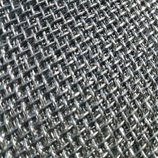 A close-up view of interlaced wire mesh used as screen material.
