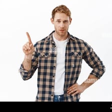 A person expressing disapproval with a raised finger.