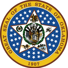 The Oklahoma state seal featuring the state motto.