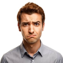 A person wearing a skeptical expression.