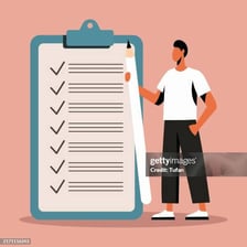 A person taking care of tasks on a checklist.
