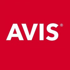 An Avis car-rental counter with the company logo