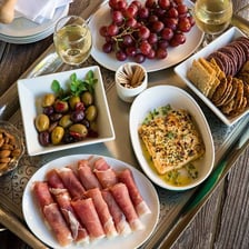 Pieces of Greek feta cheese arranged on a serving platter.