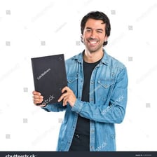 A man holding a book that belongs to him
