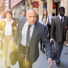 A person moving quickly along a road.