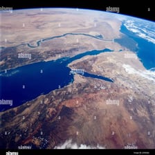 A satellite view of the Nile Delta spreading toward the Mediterranean Sea.