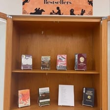 Books displayed beside a bestseller list