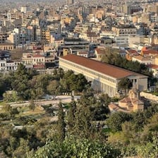 Ruins of an ancient Greek agora with surrounding columns
