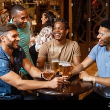 Friends enjoying drinks together in a pub