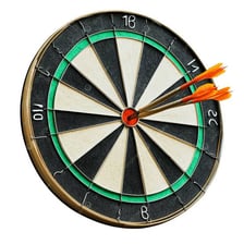 A dart hitting the exact center of a target