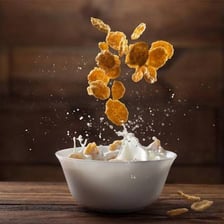 A bowl of breakfast cereal with milk