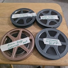 A film reel representing a complete, uncut movie.