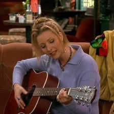 Phoebe Buffay with her guitar from Friends