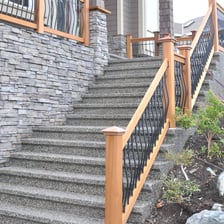 A staircase with a clearly visible wooden handrail.