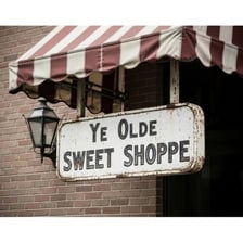 A vintage storefront using the phrase “Ye Olde Shoppe”
