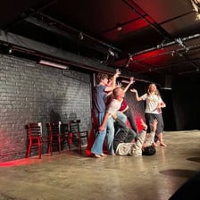 A performer improvising onstage without reading from a script.