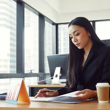 A paralegal reviewing legal documents in an office