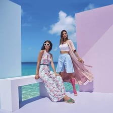Summer clothing displayed in soft pastel colors.