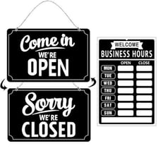 A storefront displaying an open sign after being closed.