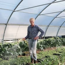 A farmer working in a rural field.