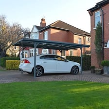 A car parked under a residential carport