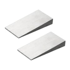A set of thin metal shims used for leveling