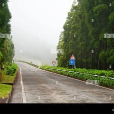 A landscape obscured by haze and reduced visibility.