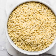 Small rice-shaped pieces of orzo pasta.