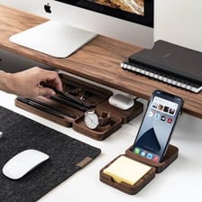 A neatly arranged collection of equipment on a desk.