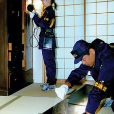 Investigators examining a police crime scene.