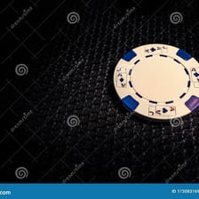 Poker chips placed in the center of a table as an ante