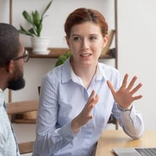 Two people engaged in a conversation