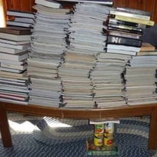 A shelf visibly drooping under the weight placed on it.