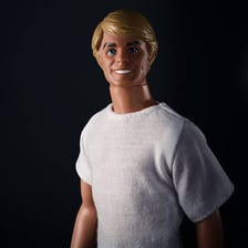 A Ken doll displayed with Barbie